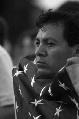 Maximiliano Hernandez holds the U.S. flag during demonstration against Arizona law 1070, also known as the Show Me Your Papers law.