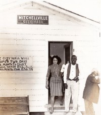 Daisy Bates leaving a meeting at the City Hall of Mitchellville, Arkansas.